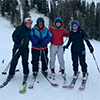 4 skiers group photo