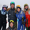 Skiing while snowing group photo